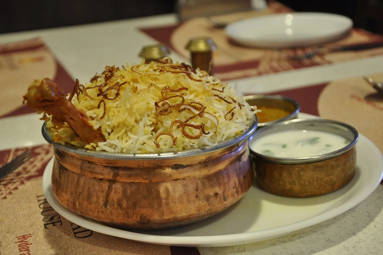 Hyderabadi chicken dum biryani with saffron-tinted rice