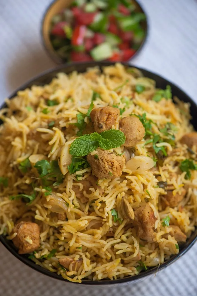 Sindhi biryani with potatoes, dried plums and green chillies